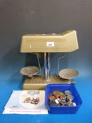 A vintage Moneychecker weighing machine/scales with weights and instructions
