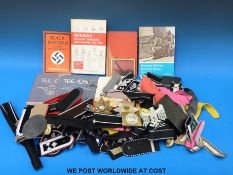 A large collection of mainly replica military badges including cloth examples, Nazi German etc.