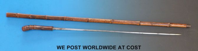 A Solingen sword stick with square blade marked Solingen A05 FWO with bamboo sheath and handle