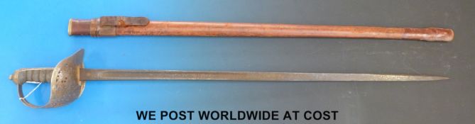 An 1897 pattern sword in leather scabbard, possibly by Mole.  Impressed no: 4723 to blade.
