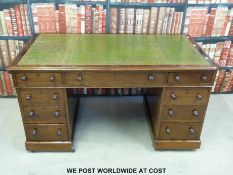 A mahogany twin pedestal desk (W135 x D74 x H74cm)