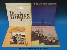 A diverse selection of long playing records including Boomtown Rats, Carpenters, John Denver,