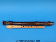 A Kung rosewood descant recorder together with a maple wood Hermann Moeck Celle Flote recorder