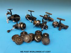 Six Mitchell fixed spool fishing reels and a quantity of spare spools for various reels.