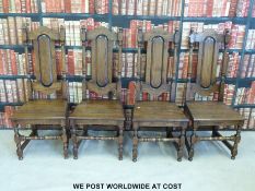 A set of eight (6+2) oak solid seat dining chairs with panelled backs