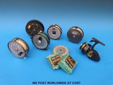 A collection of fly fishing reels with lines and a Morrits Intrepid De Luxe fixed spool reel in box.