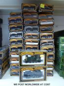 Thirty two Mainline 00 gauge carriages and two locomotives,