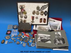 A quantity of mainly Nazi German militaria including flag, badges including pre-war examples,