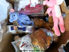 Approximately 100 aminly TY Beanie Babies, some in original cases, almost all with original labels.
