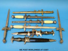 A quantity of replica Nazi and other daggers to include chained SS,