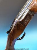 Miroku 12 bore over and under ejector shotgun with engraved cartouche, single selective trigger,
