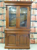 A modern bookcase with glazed top section (W120 x D49 x H212cm)