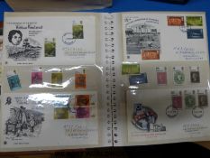 A large quantity of GB first day covers in four albums,