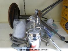 A commercial paint spray gun and accessories and a potters stool