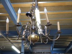 A metal six branch chandelier fitted for electricity with stylised animal decoration