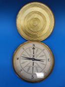 A gilt cased E.J. Arnold & Sons, Leeds, educational compass, 21 cm in diameter.