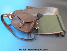 A Parsons leather gun slip together with a leather cartridge bag plus one other gun slip.