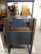 An ex shop display cabinet with glazed cabinets to top and rail above,