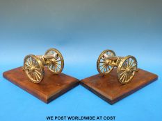 A pair of hallmarked silver cannon of Boer War interest, mounted on brass gun carriages,
