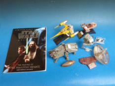 A quantity of CFC & Hasbro Star Wars figures and vehicles and a Star Wars book,