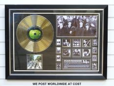A framed and glazed gold disc of The Beatles album Abbey Road.