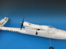 A Bixler2 radio controlled aeroplane together with a radio controlled helicopter,