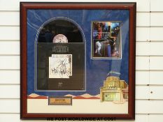 An autographed montage of the Led Zeppelin album The Song Remains the Same.