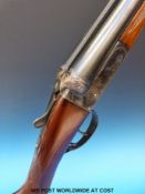 A 12 bore side by side Spanish boxlock shotgun with slip hard case and two hammer gun stocks and