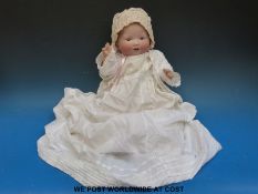An Armand Marseille bisque headed doll with open mouth and weighted blue eyes,