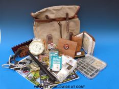 A miscellaneous collection of fishing accessories including a well filled compartmentalised
