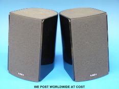 A pair of Acoustic Energy AEGO T satellite speakers.