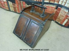 An unusual coal box with mechanism opening doors operated by top handle