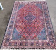 A large wool Persian rug