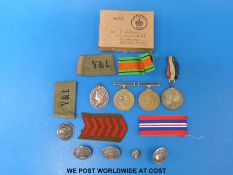 A WWII medal group comprising 1939 - 45 Defence medal, 1939 - 45 medal and Efficiency medal,