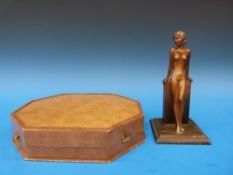 A bronzed nude (21cm tall) signed 'Lorenzl' together with a case manicure set in silver plate and