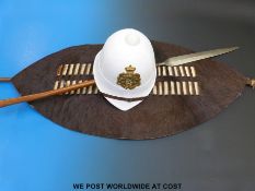 An African hide shield, African spear and helmet.