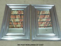 A pair of designer mirrors with metal frames (overall size 61 x 91cm)