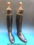 A pair of black leather riding boots with Maxwell of London trees together  with boot jack, spurs,