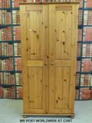 A pine two door wardrobe (W90 x D58 x H188cm)