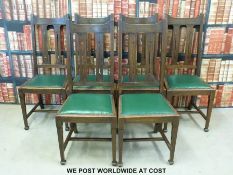 Six oak dining chairs with pieced Art Nouveau decoration and upholstered seats.