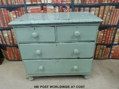 A painted pine chest of drawers (W91 x D45 x H87cm) and a table