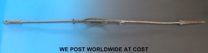 A bronze or similar African throwing spear