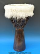 A mushroom shaped wooden African drum (167cm tall,