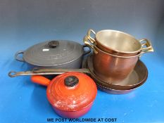 A Le Creuset casserole and pan,