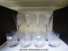 A set of eight cut glass wine glasses together with eight matching whisky tumblers