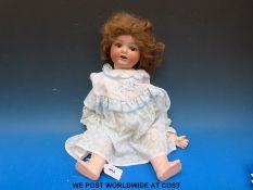 An Armand Marseille bisque-headed doll with AM 1330 impressed verso