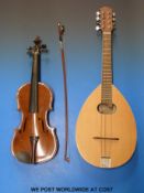 A late 20thC flat-backed mandolin together with a vintage anonymous violin with 35.