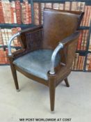 Twenty Art Deco style leather arm chairs with wicker inset side panels and curved metal arms raised