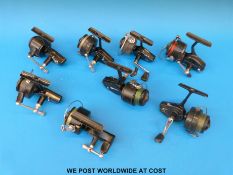 Eight Mitchell fixed spool fishing reels, models including 206, 324, 300A, 320 etc.