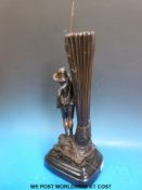 A spelter figural vase of a boy fishing on shaped marble base (height 48cm)